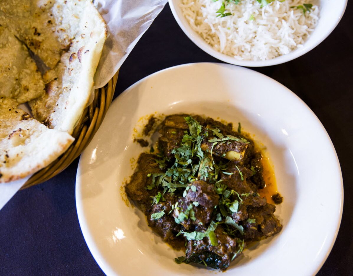 Tawa pepper fry goat with garlic naan and rice 