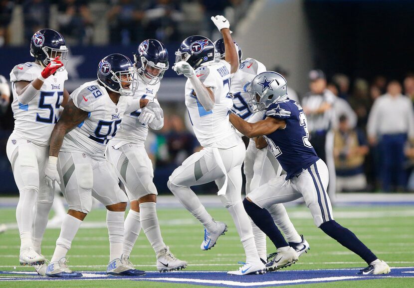 Dallas Cowboys cornerback Byron Jones (31) shoves Tennessee Titans free safety Kevin Byard...