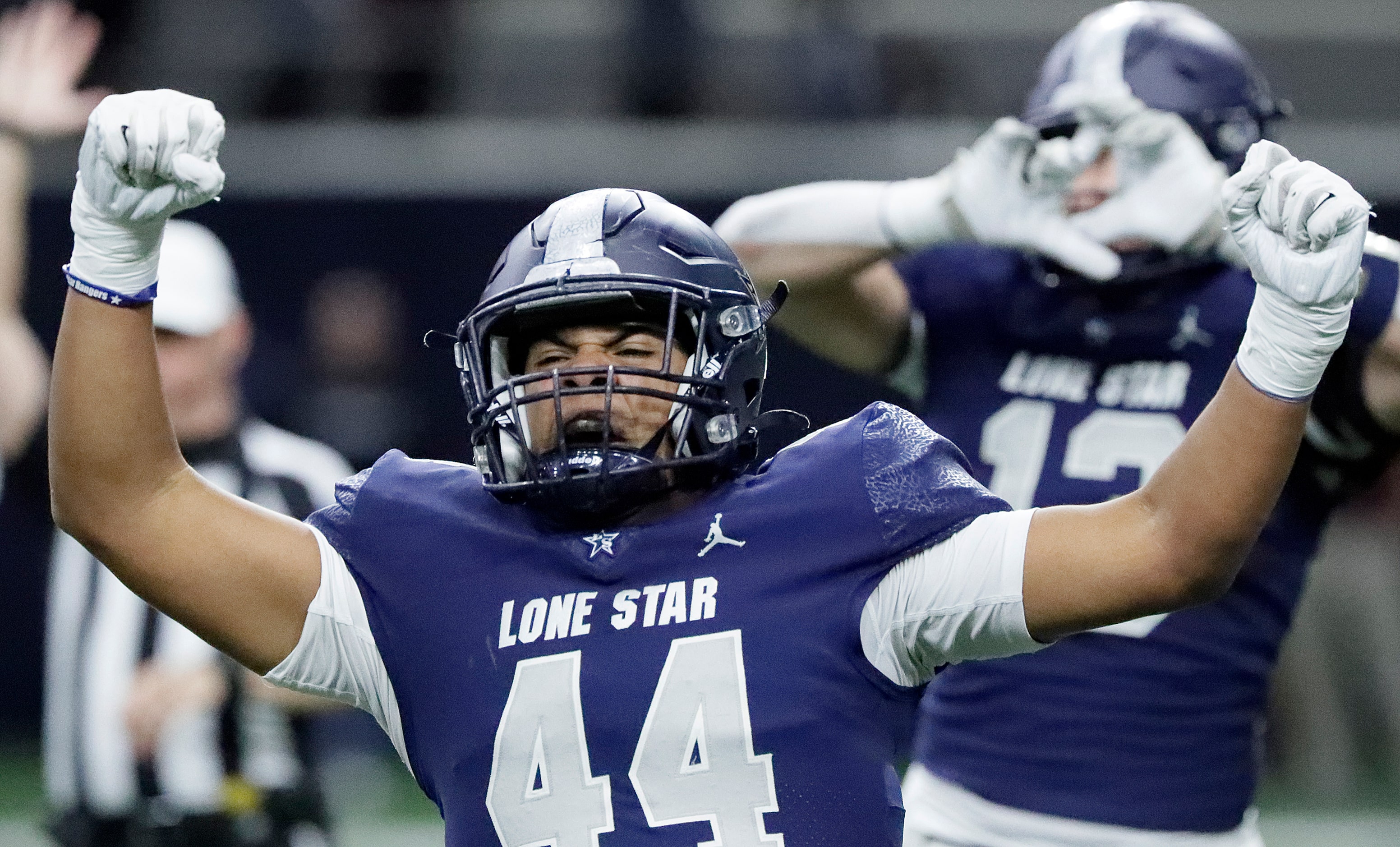 Lone Star High School defensive lineman Marcel Dominguez (44) celebrates a defensive sack...