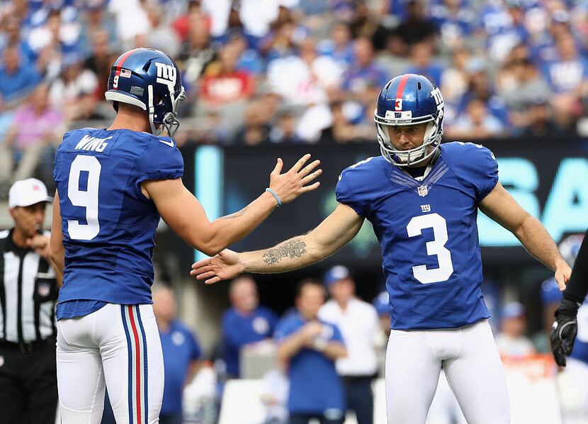 EAST RUTHERFORD, NJ - SEPTEMBER 18:  Josh Brown #3 of the New York Giants celebrates kicking...