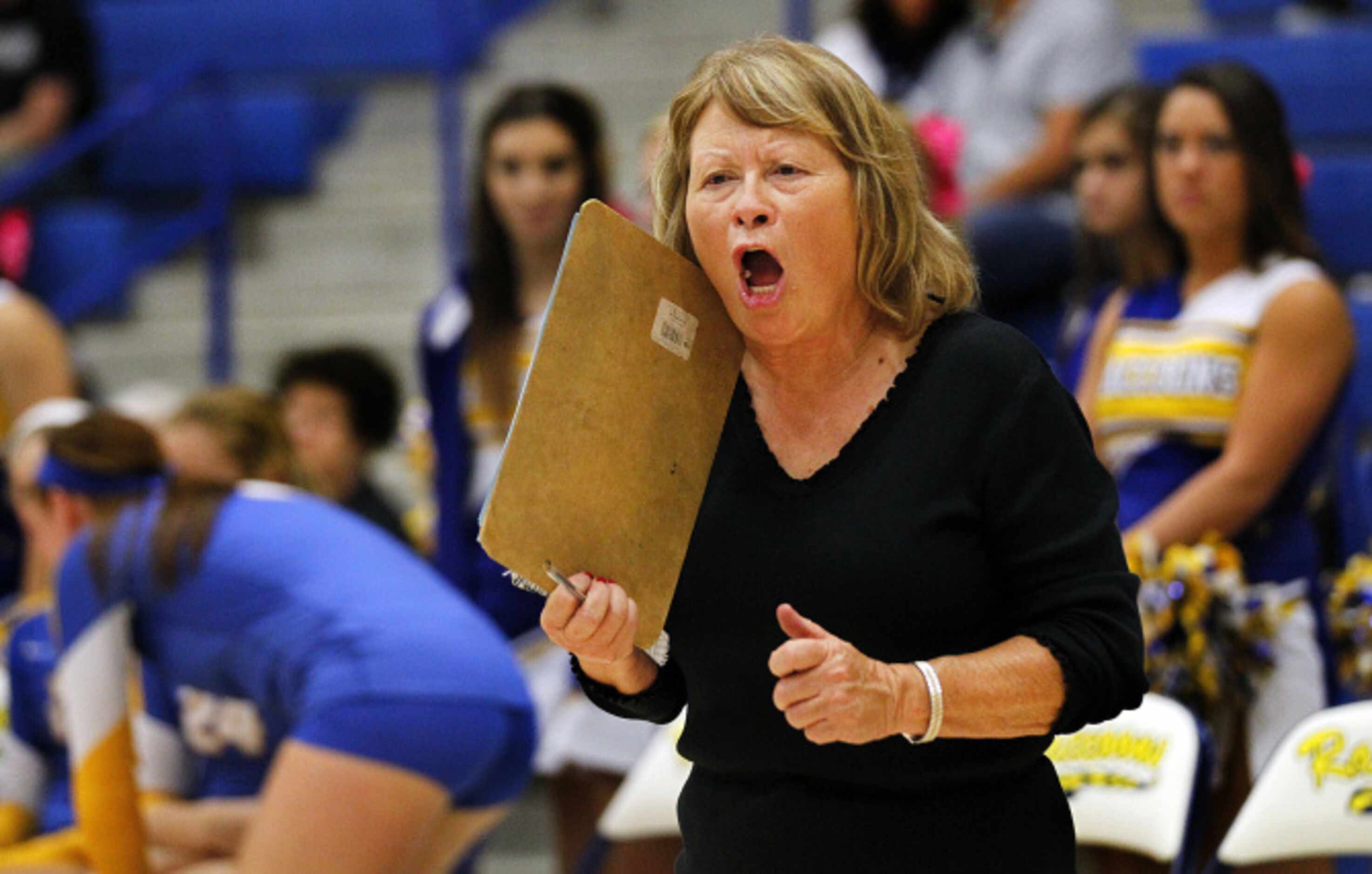 Frisco High volleyball coach Janie Litchford yells instruct not her players during their...