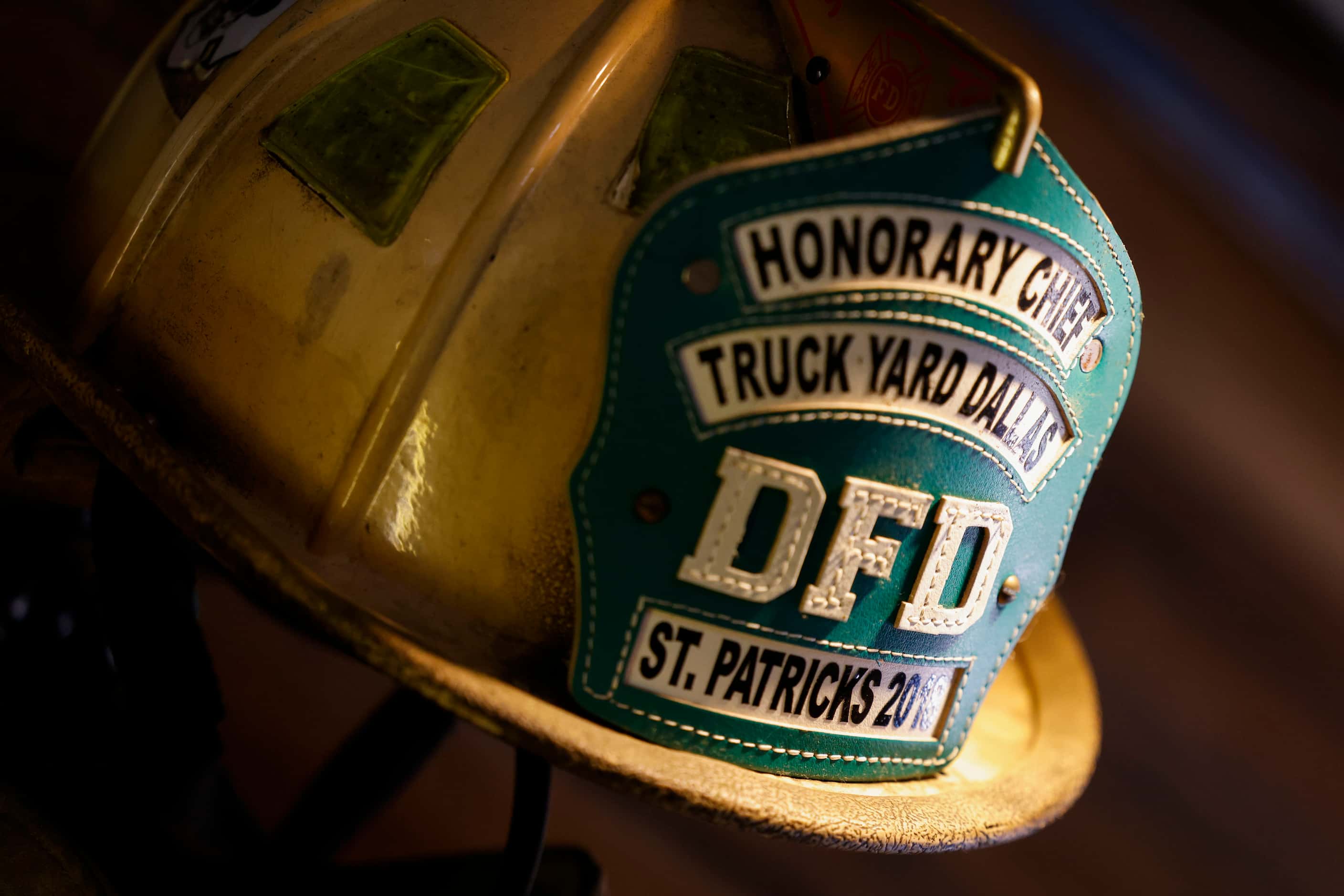 An honorary Dallas Fire Department helmet hangs on the wall at Truck Yard in Dallas. The bar...