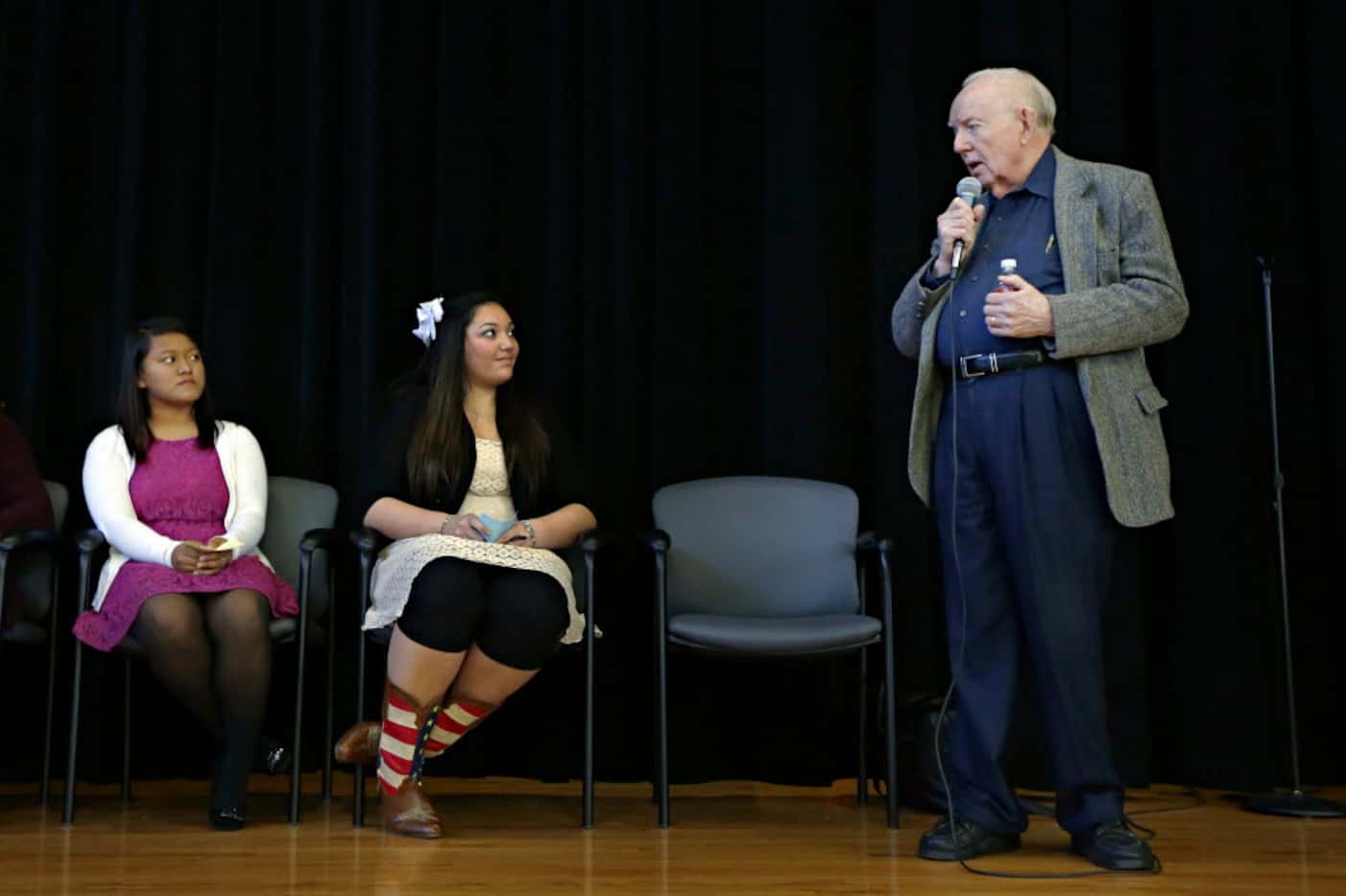 Dr. Robert McClelland spoke as students Sylvia Mualcin (left) and Kayla Conner listened on...