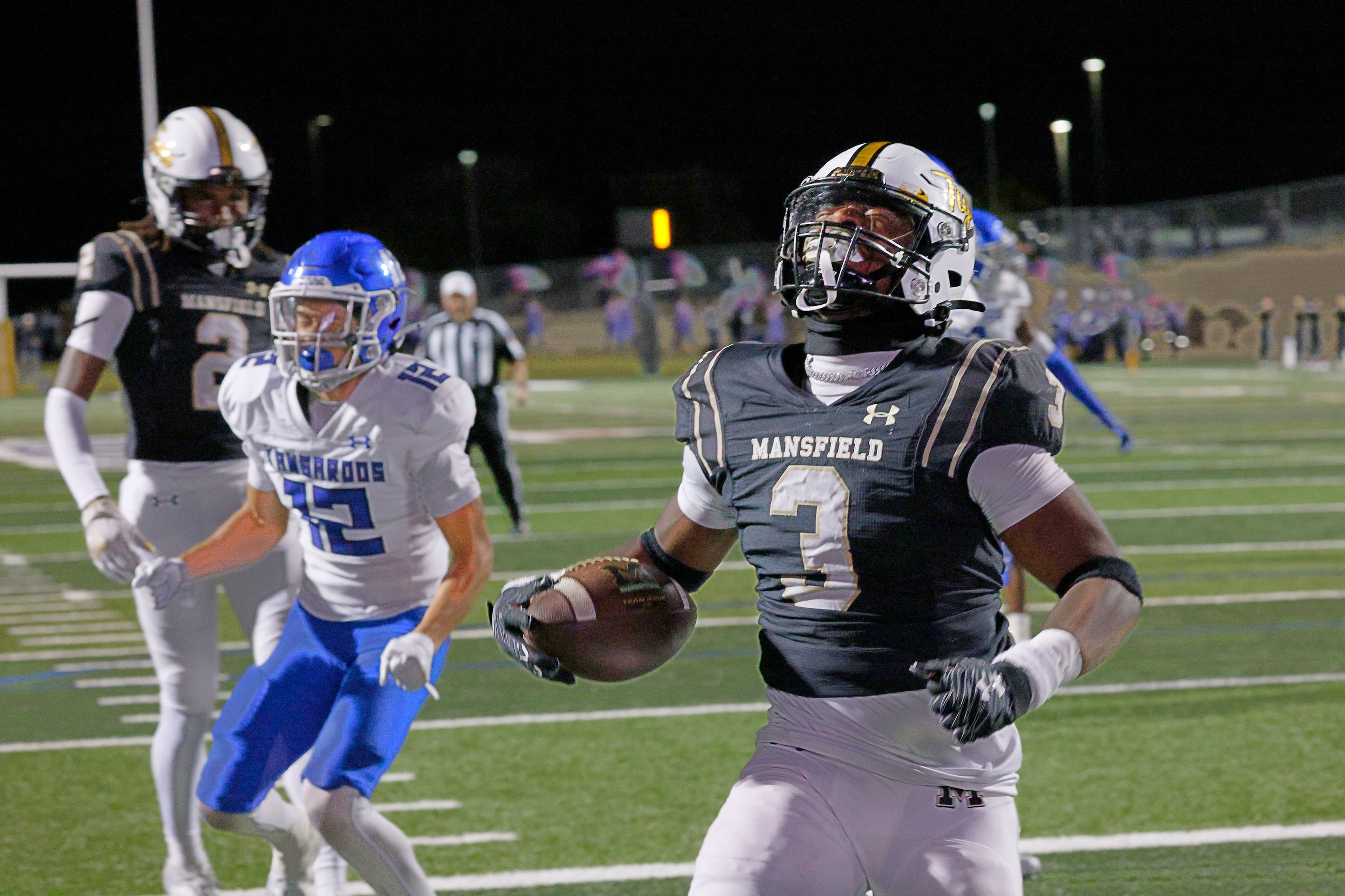 Mansfield's Teddy Clark (3) reacts after scoring a touchdown against Weatherford as...