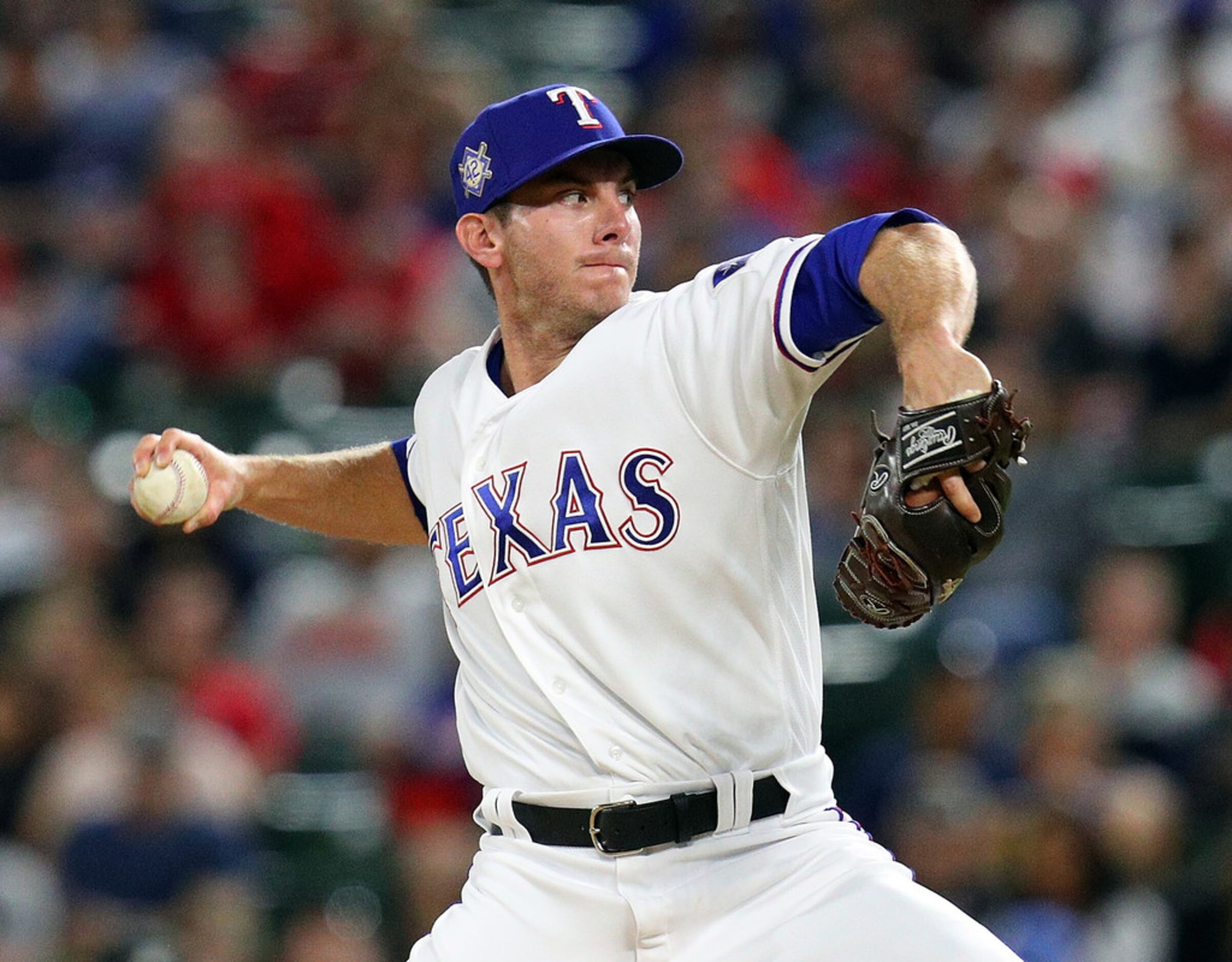 ARLINGTON, TEXAS - APRIL 15: Kyle Dowdy #43 of the Texas Rangers pitches in the fifth inning...