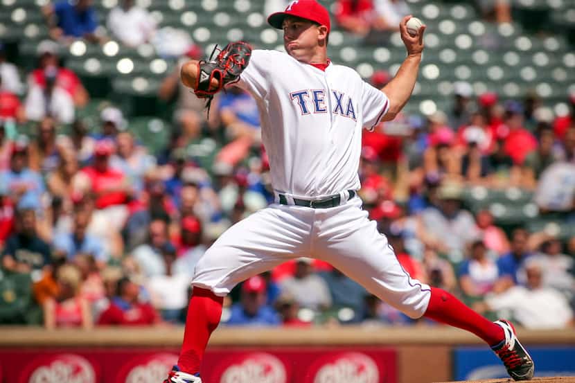 Texas Rangers starting pitcher Derek Holland (45) works the first inning against the...