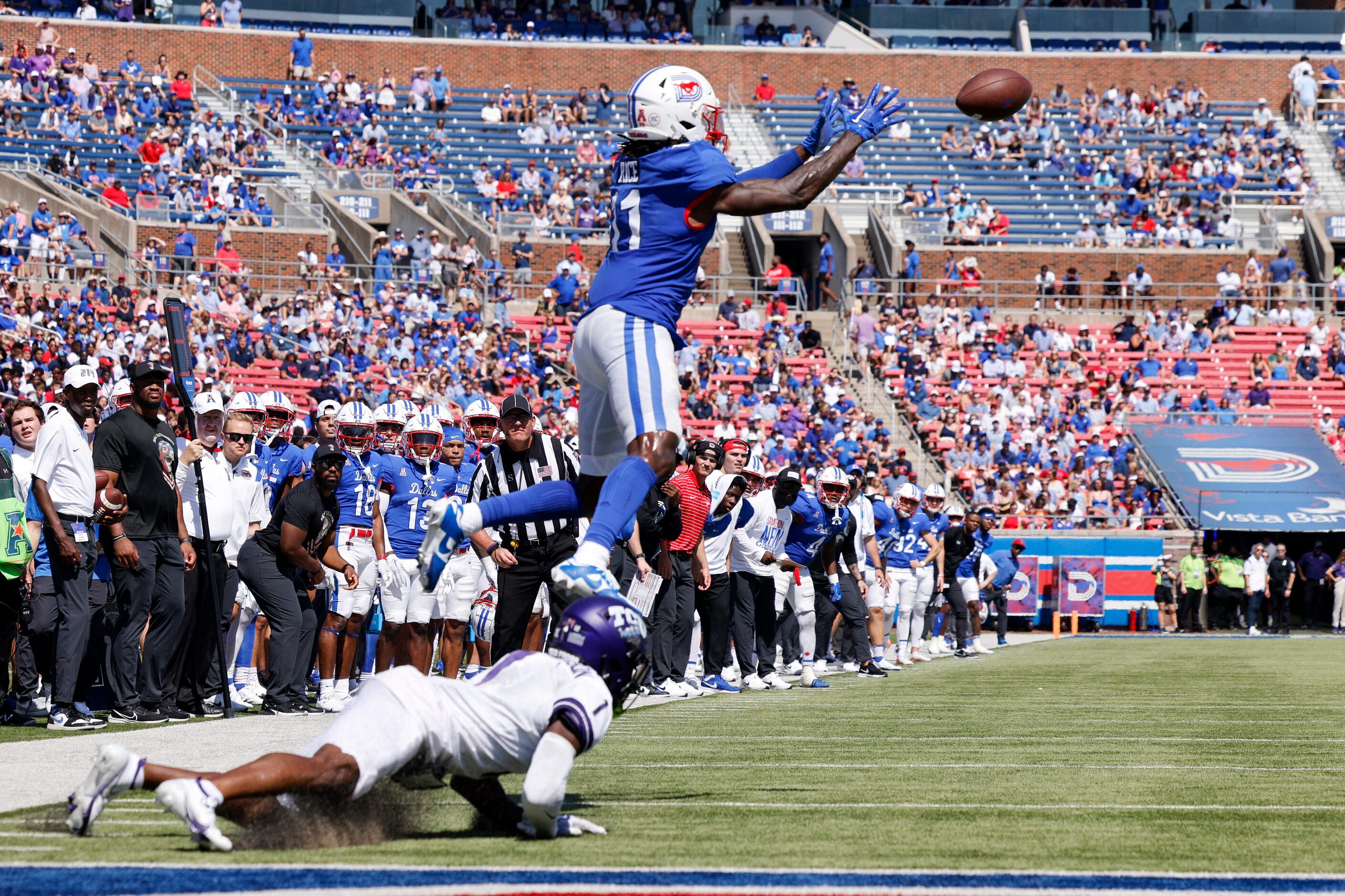 SMU wide receiver Rashee Rice (11) catches a pass for a touchdown ahead of a falling TCU...