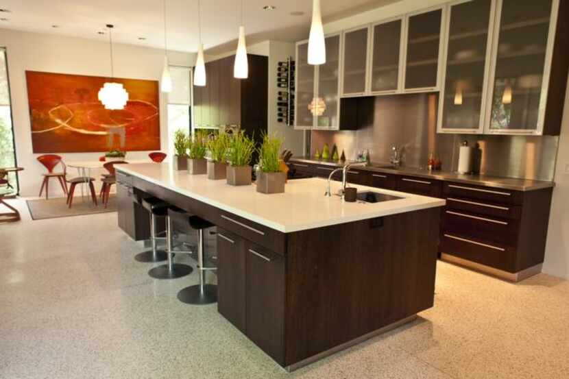 
The spacious open kitchen in one of the tour houses features terrazzo floors. 
