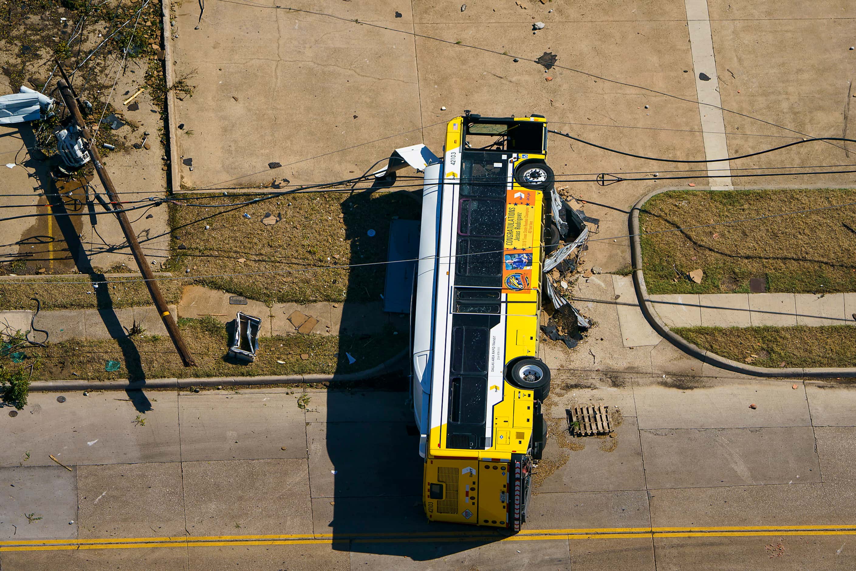 A overturned DART bus is seen near Walnut HIll Lane and Denton Drive on Monday, Oct. 21,...