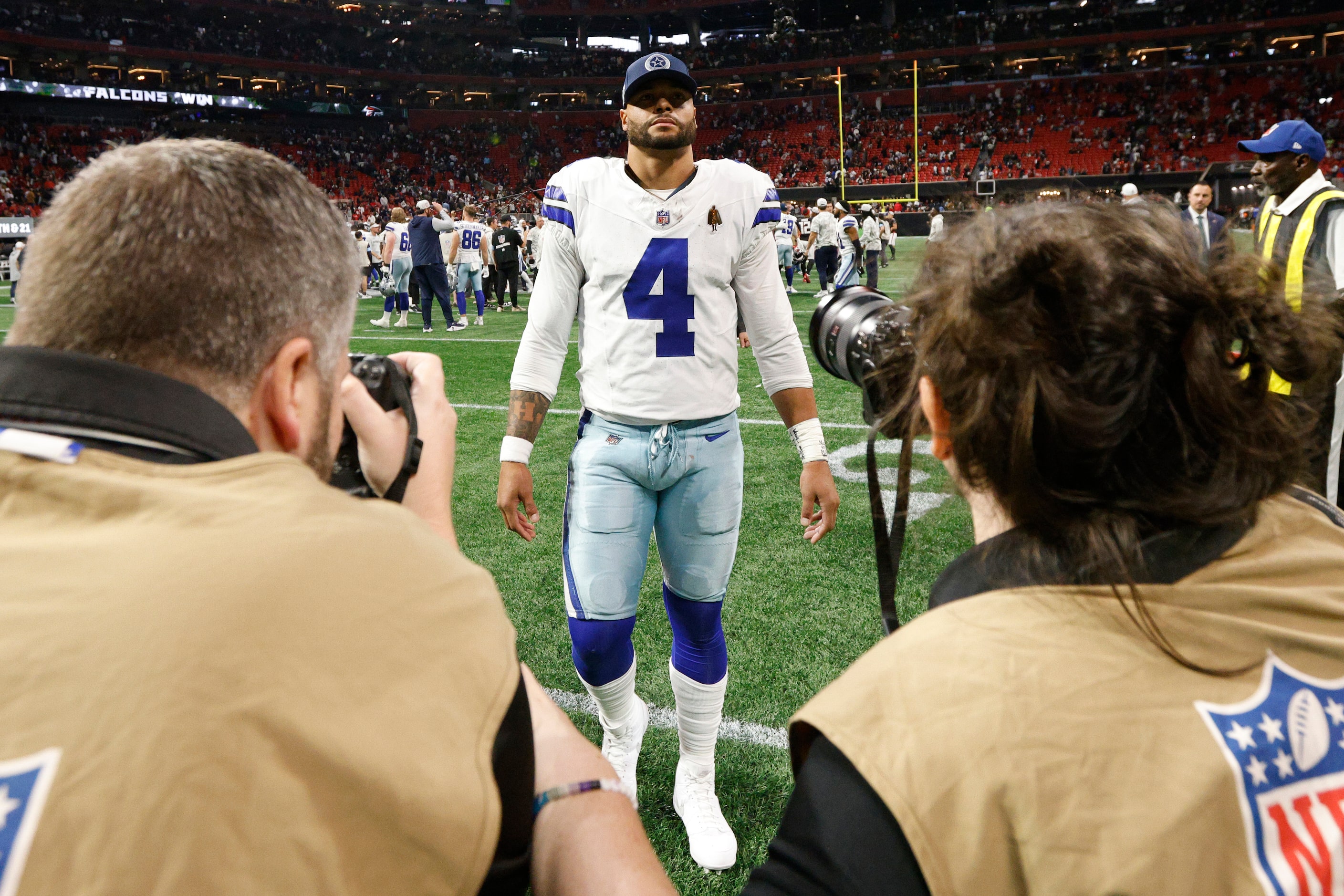 Dallas Cowboys quarterback Dak Prescott (4) walks off the field after a game against the...