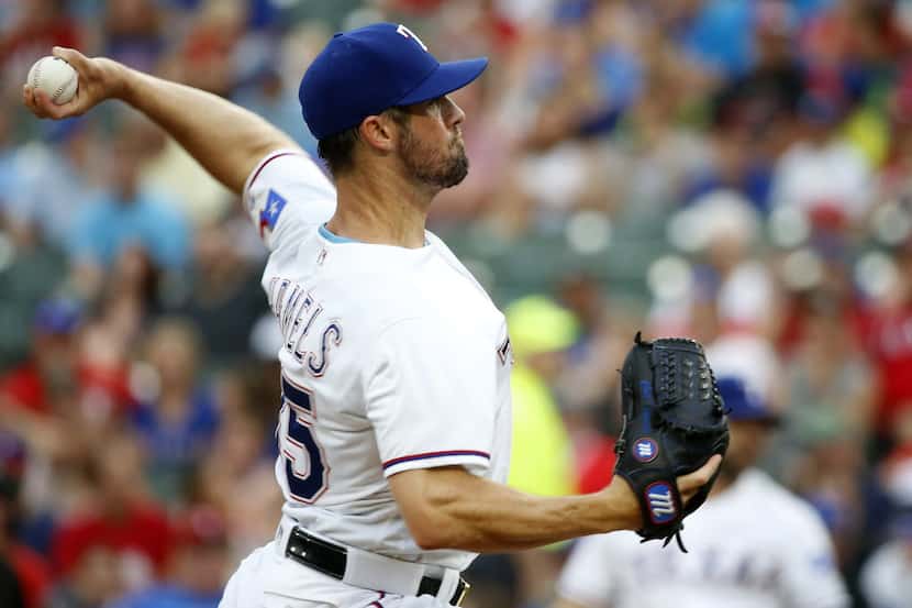 Texas Rangers starting pitcher Cole Hamels throws a pitch against Kansas City Royals during...