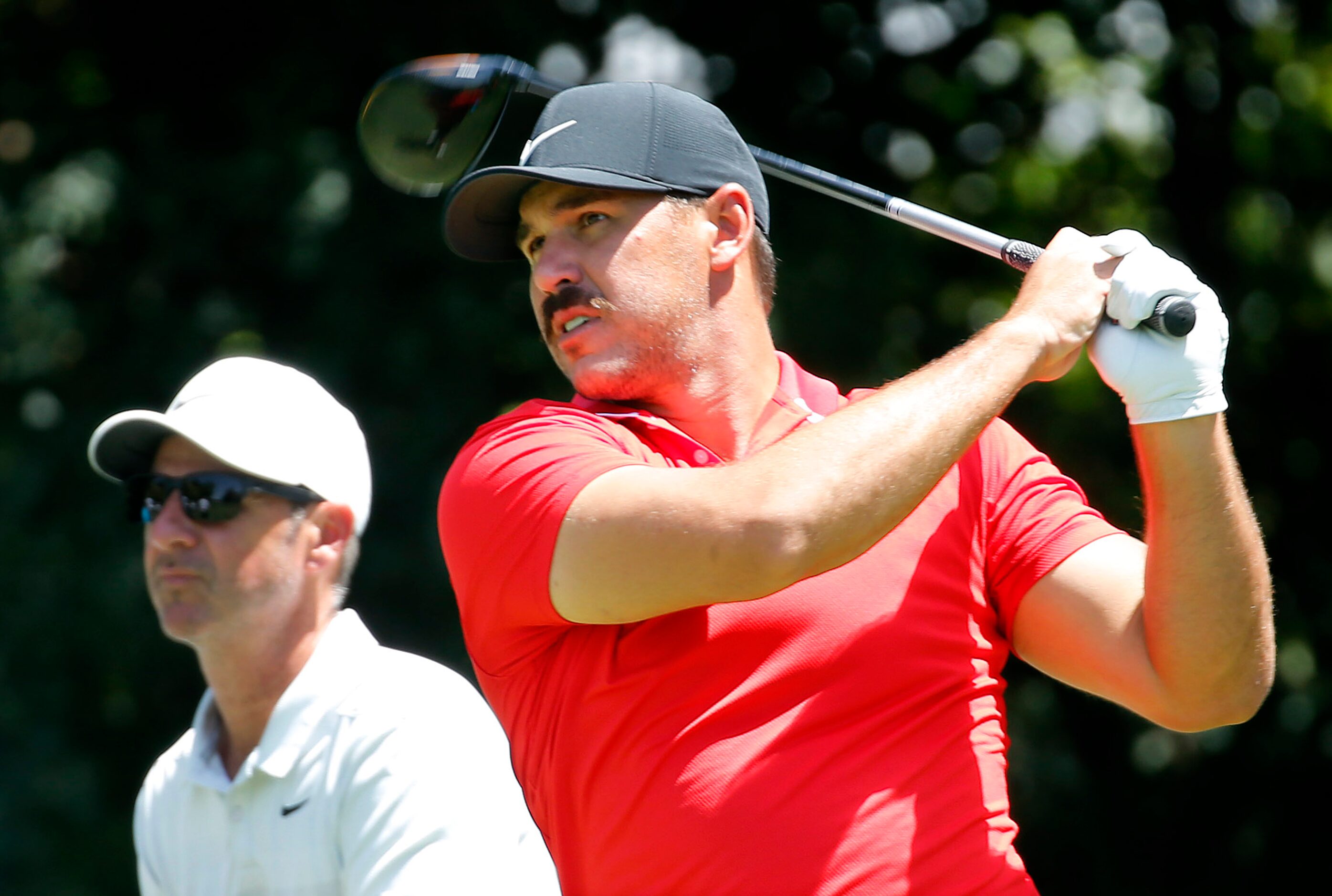 PGA golfer Brooks Koepka tees off on No. 12 during the Charles Schwab Challenge practice...