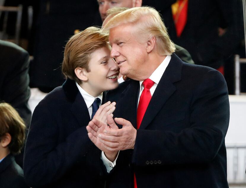 President Donald Trump smiles with his son Barron as they view the 58th Presidential...