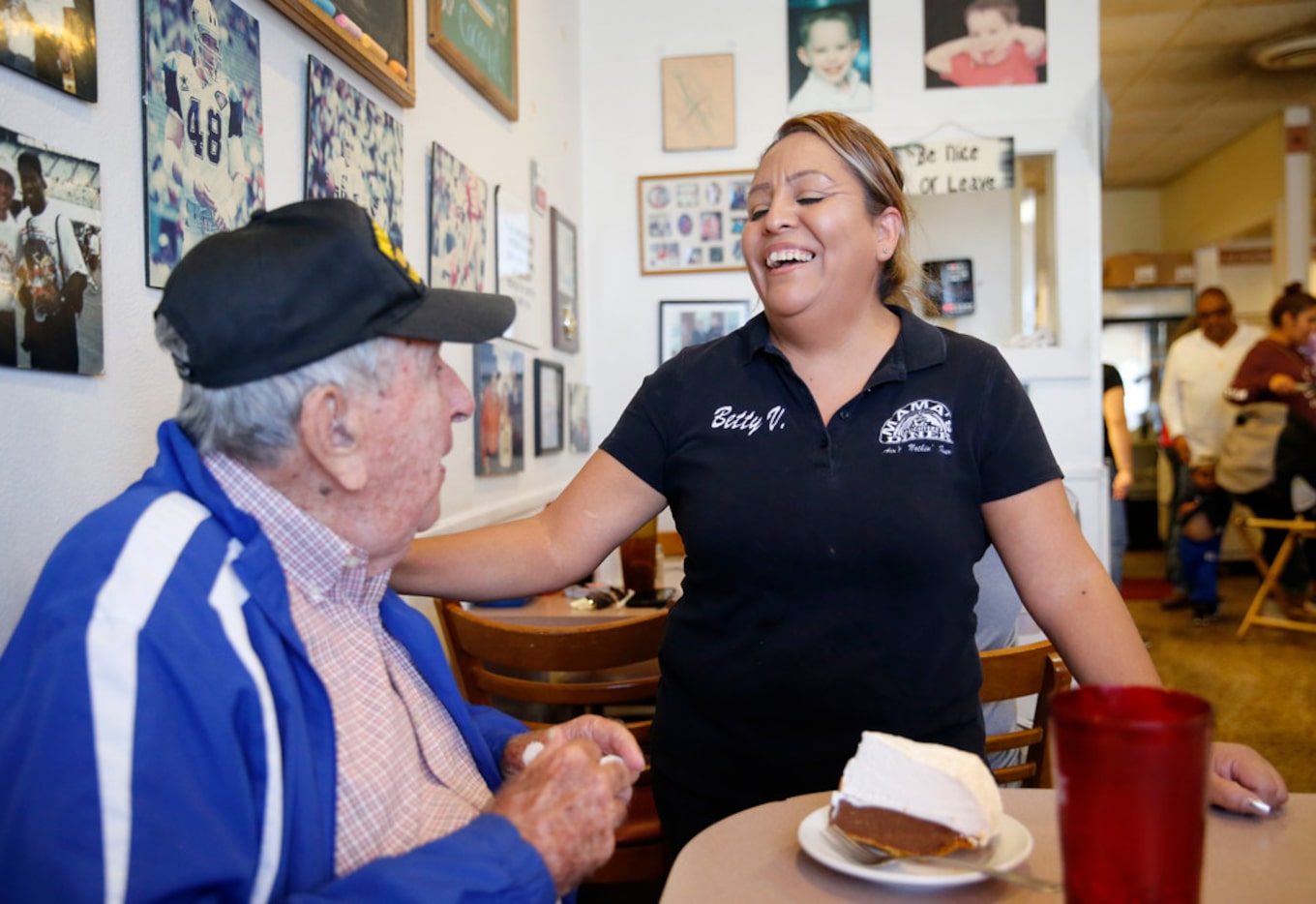 Chester Hollingsworth shares a laugh with Betty Vazquez shortly after the crew sang happy...