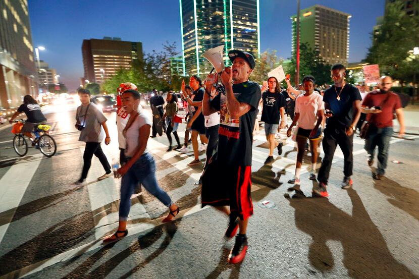 Protesters cross Commerce St. during the Next Generation Action Network protest in downtown...