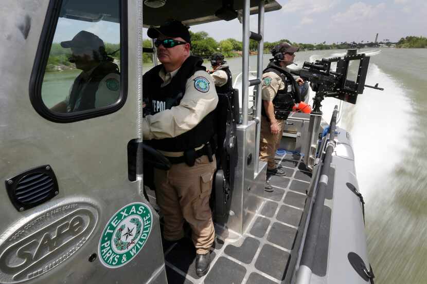 Texas Parks and Wildlife Wardens patrol the Rio Grand on the U.S.-Mexico border in Mission. 