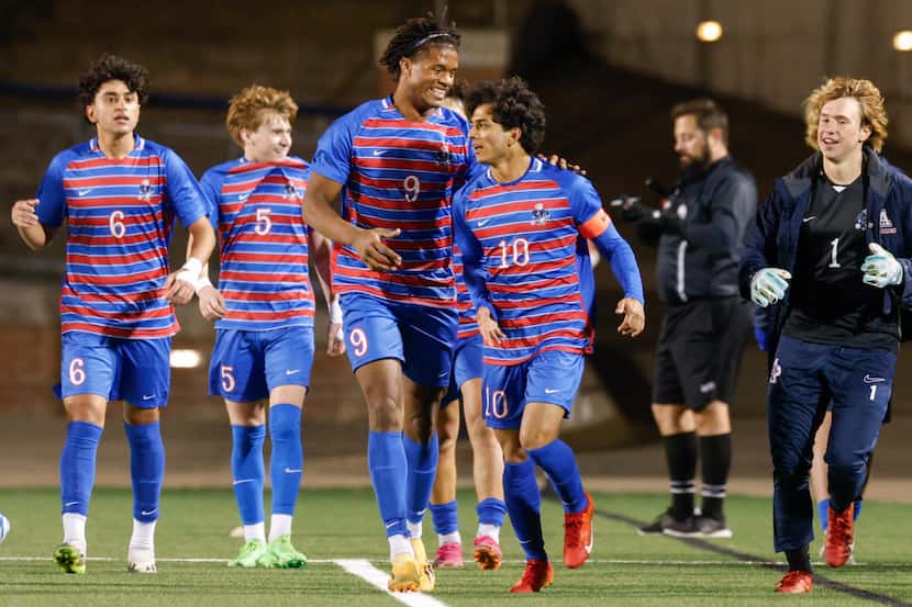Allen’s Zayan Ahmed (10) celebrates his goal with teammate Josh Daley (9) during the first...