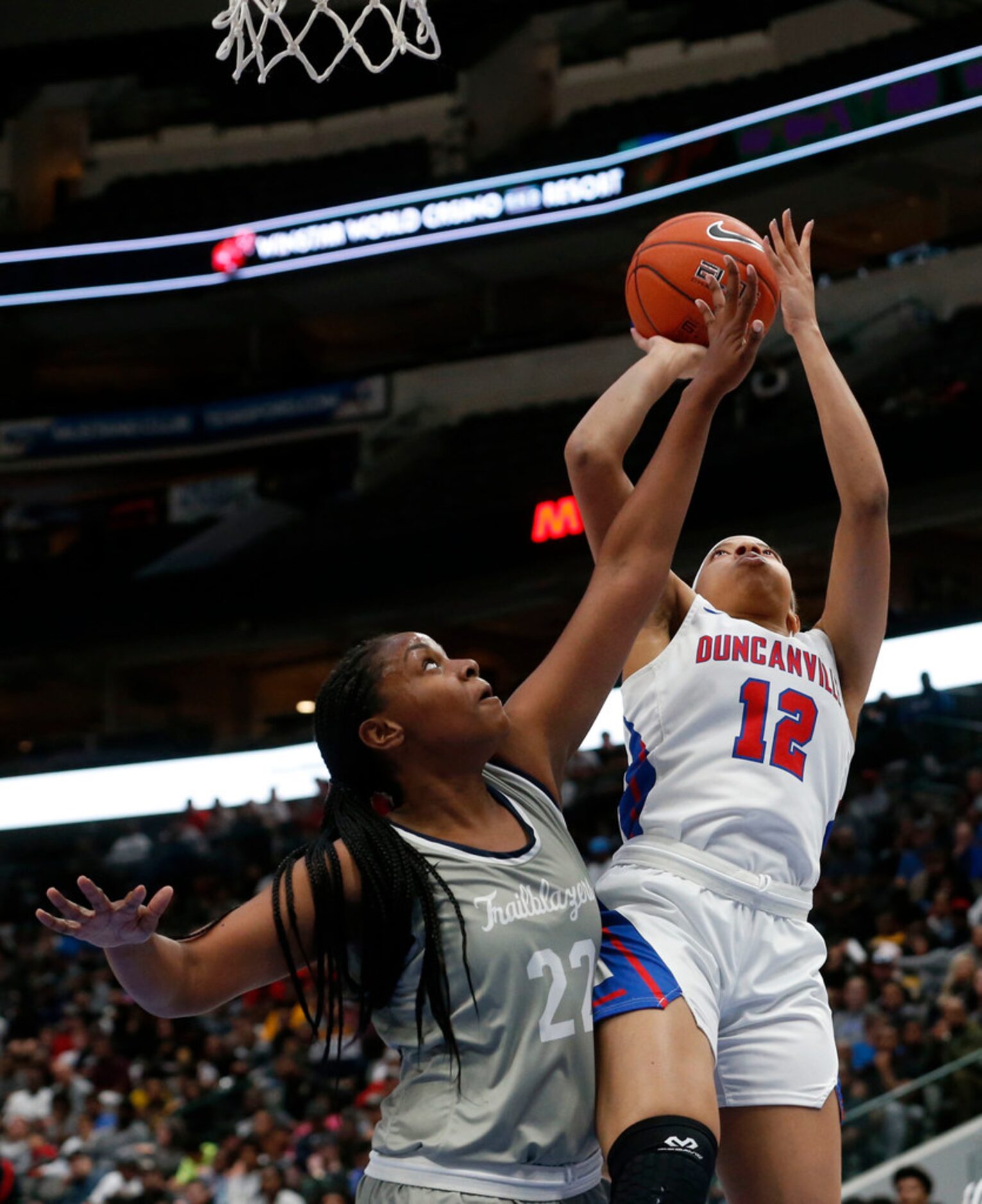 Duncaville's Zaria Rufus (12) shoots over Sierra Canyon's Theresa Berry (22) during their...