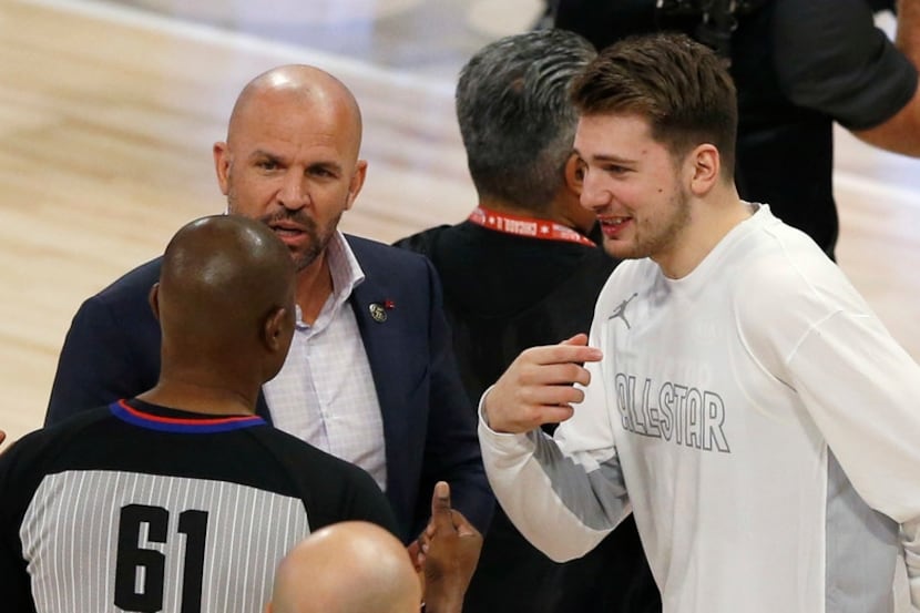 Team LeBron's assistant coach Jason Kidd and Luka Doncic talk with an official during a...