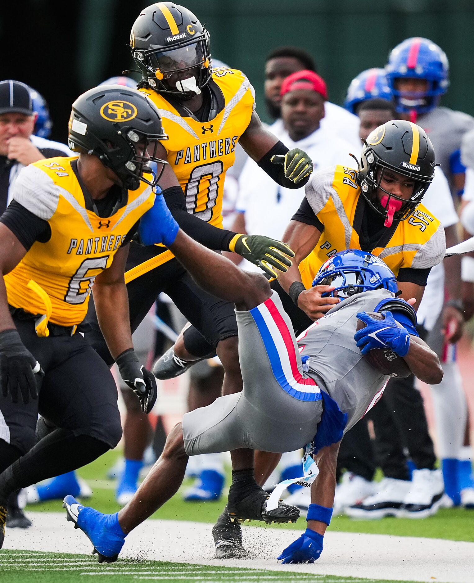 Duncanville wide receiver Ayson Theus is brought down by St. Frances Academy defensive...