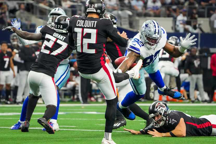Dallas Cowboys defensive end Dorance Armstrong (92) blocks a punt by Atlanta Falcons punter...