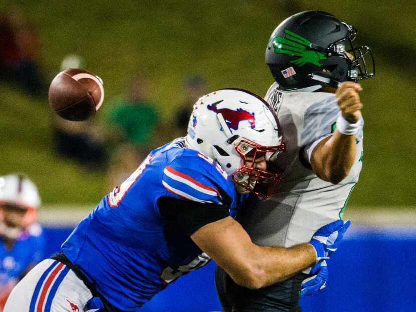 Southern Methodist Mustangs defensive end Justin Lawler (99) sacks North Texas Mean Green...