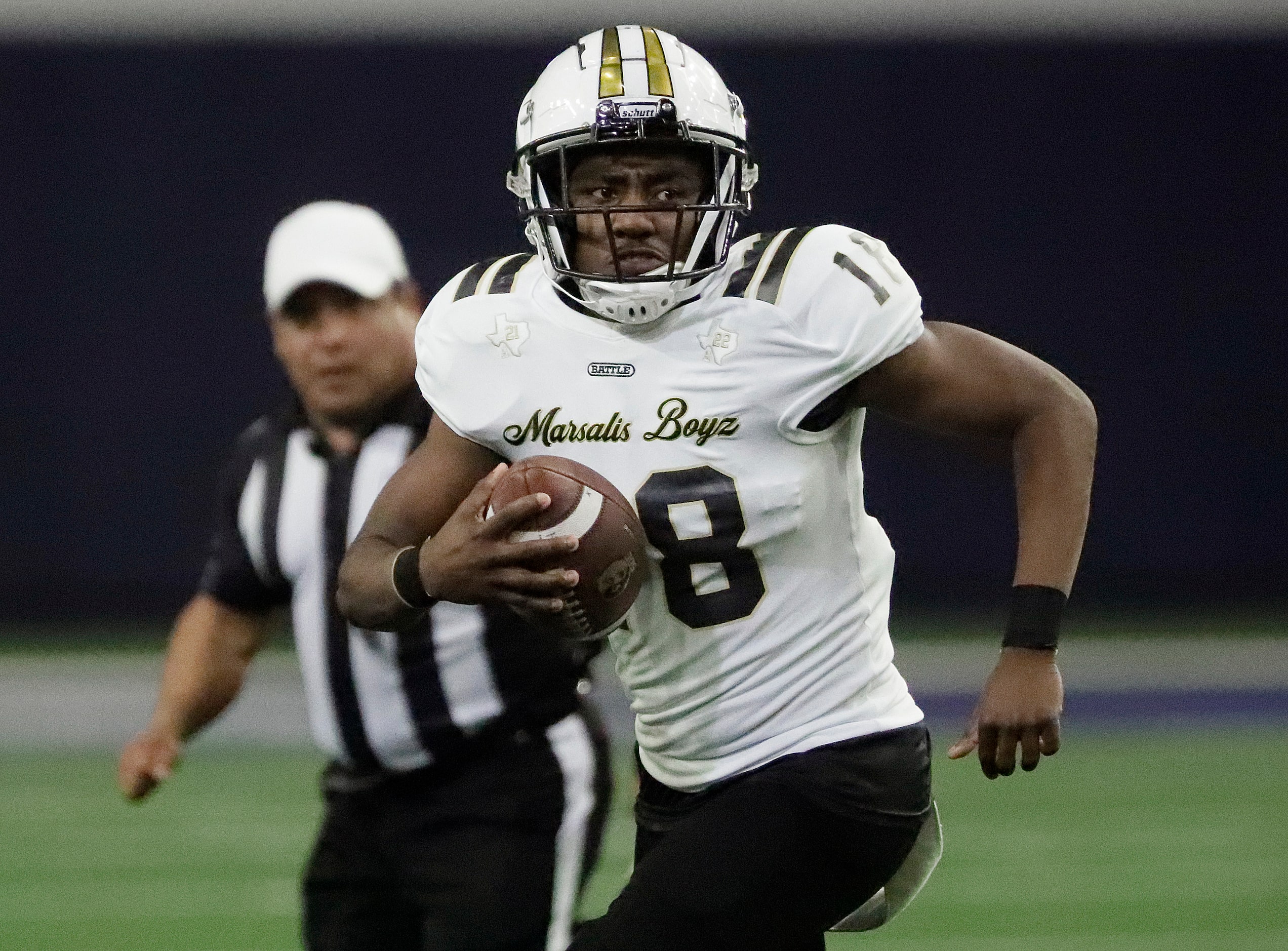 South Oak Cliff High School quarterback William Little (18) runs the ball during the first...