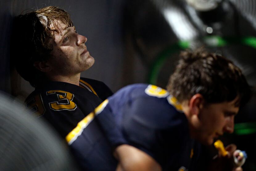 Highland Park's William Neely stares off dejectedly late in the second half of a 40-13 loss...