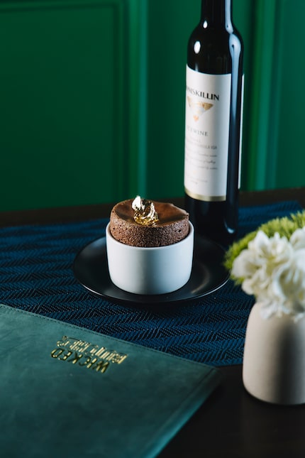 Molten chocolate souffle, served with 72% Valrhona chocolate and crème anglaise, is one of...