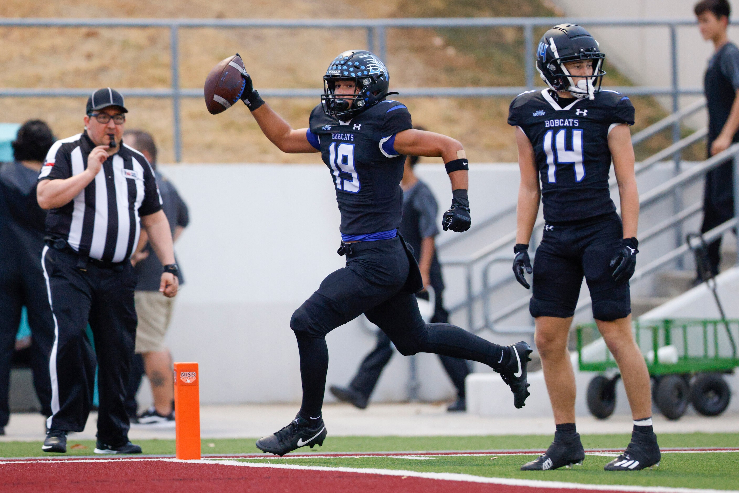 Trophy Club Byron Nelson wide receiver Parker Almanza (19) celebrates as he scores a...