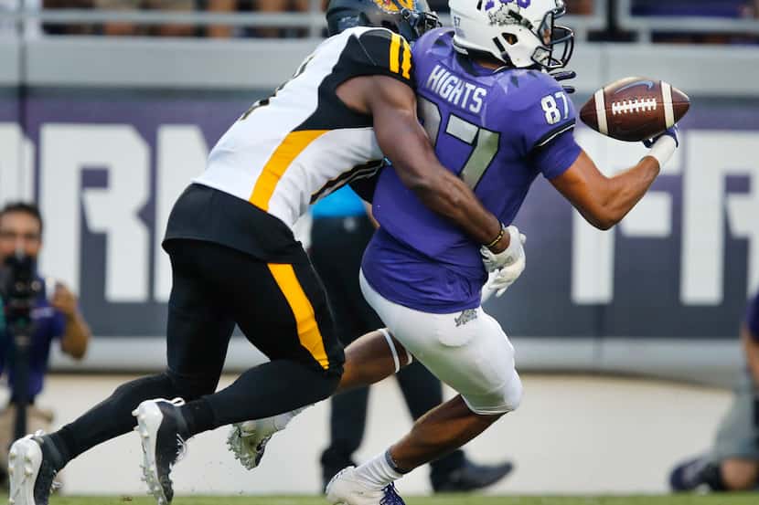 TCU Horned Frogs wide receiver TreVontae Hights (87) looses the ball while running for the...