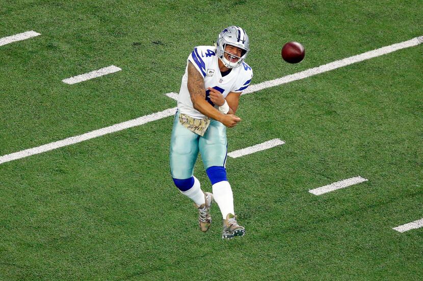 Dallas Cowboys quarterback Dak Prescott (4) releases a first quarter pass after rolling out...