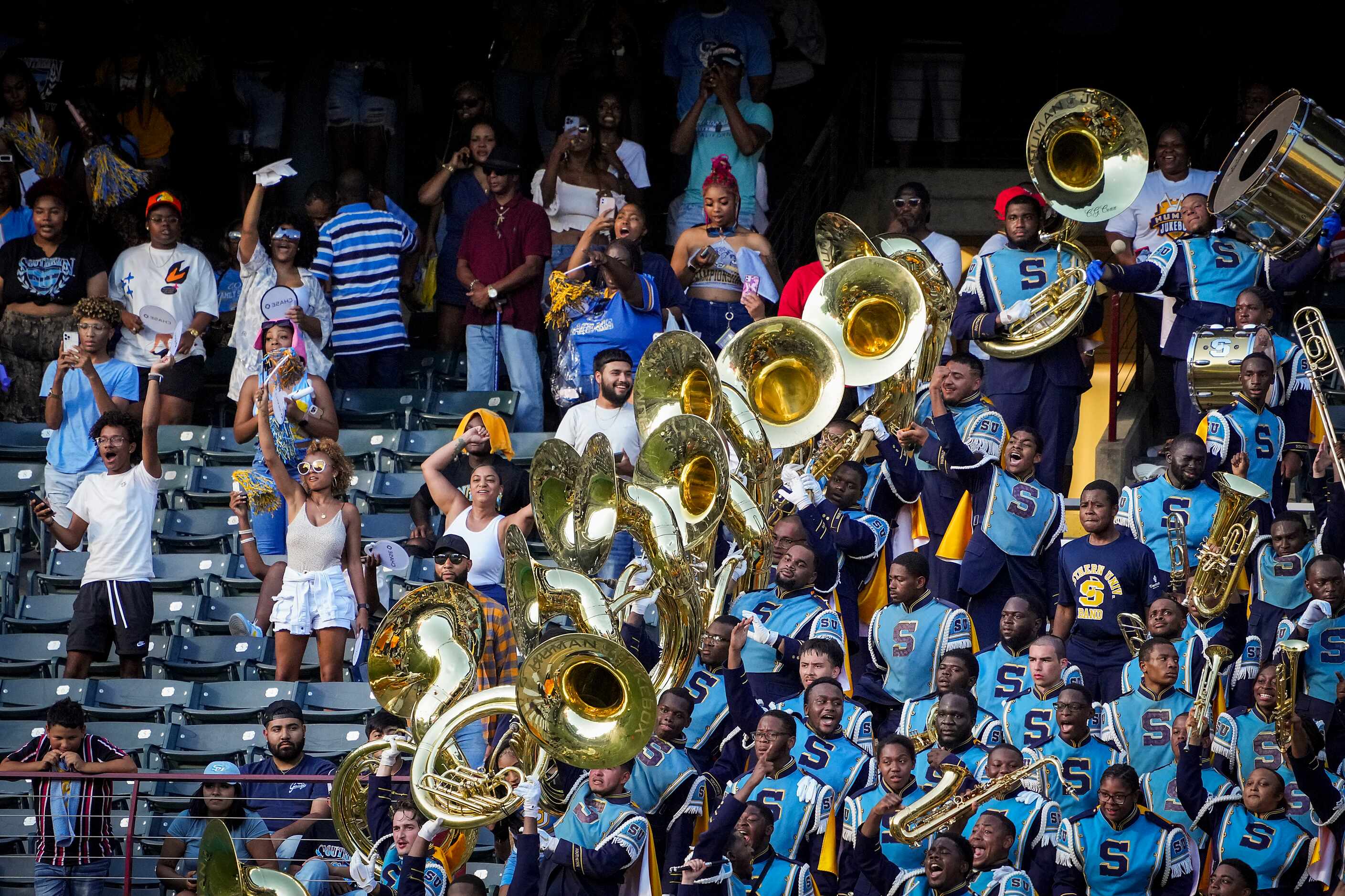 Southern  fans and members of the Human Jukebox marching band cheer as the TSU band performs...