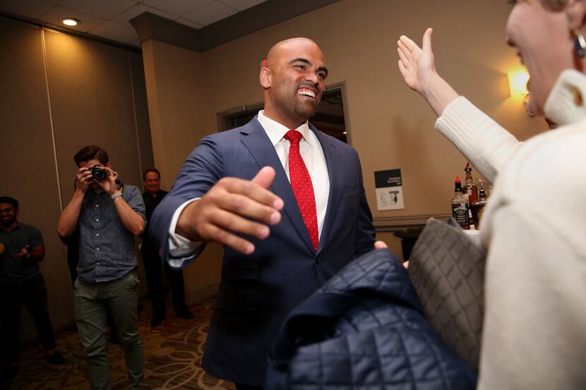 Colin Allred, democratic candidate for Texas' 32nd Congressional District, is congratulated...