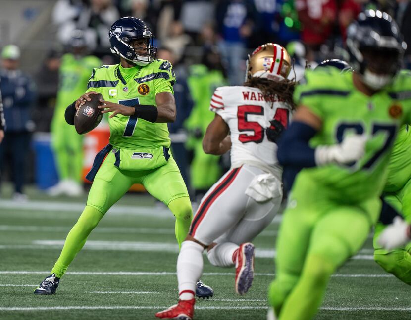 Seattle Seahwks quarterback Geno Smith looks to pass against the San Francisco 49ers during...