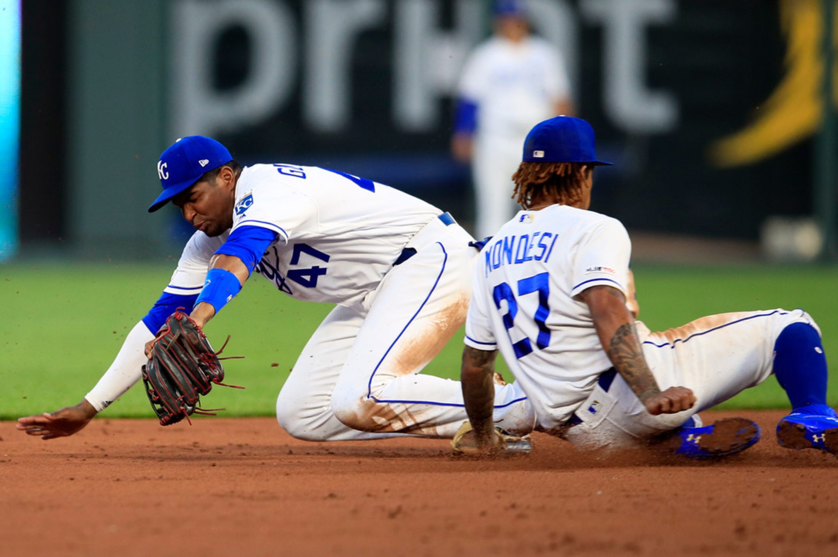 Kansas City Royals third baseman Kelvin Gutierrez (47) and Kansas City Royals shortstop...