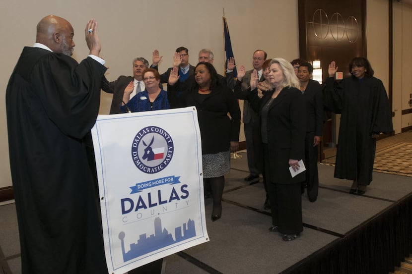 Reelected and new civil court judges are sworn in by 14th Judicial District Court Judge Eric...