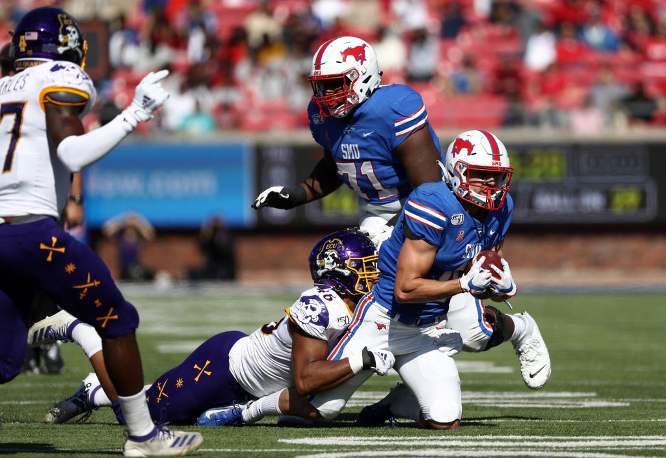 DALLAS, TEXAS - NOVEMBER 09:  Tyler Page #4 of the Southern Methodist Mustangs runs the ball...