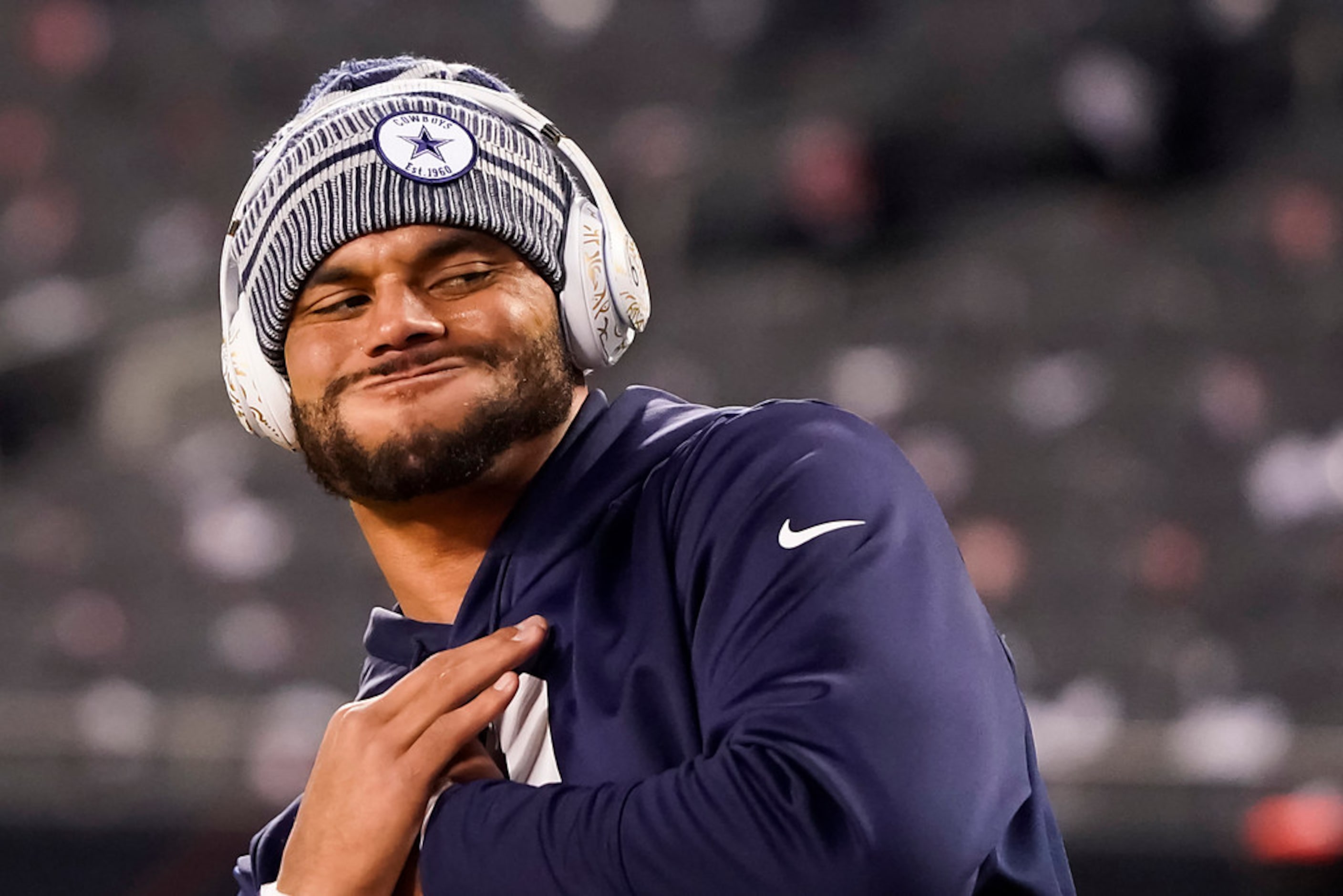 Dallas Cowboys quarterback Dak Prescott warms up before an NFL football game against the...