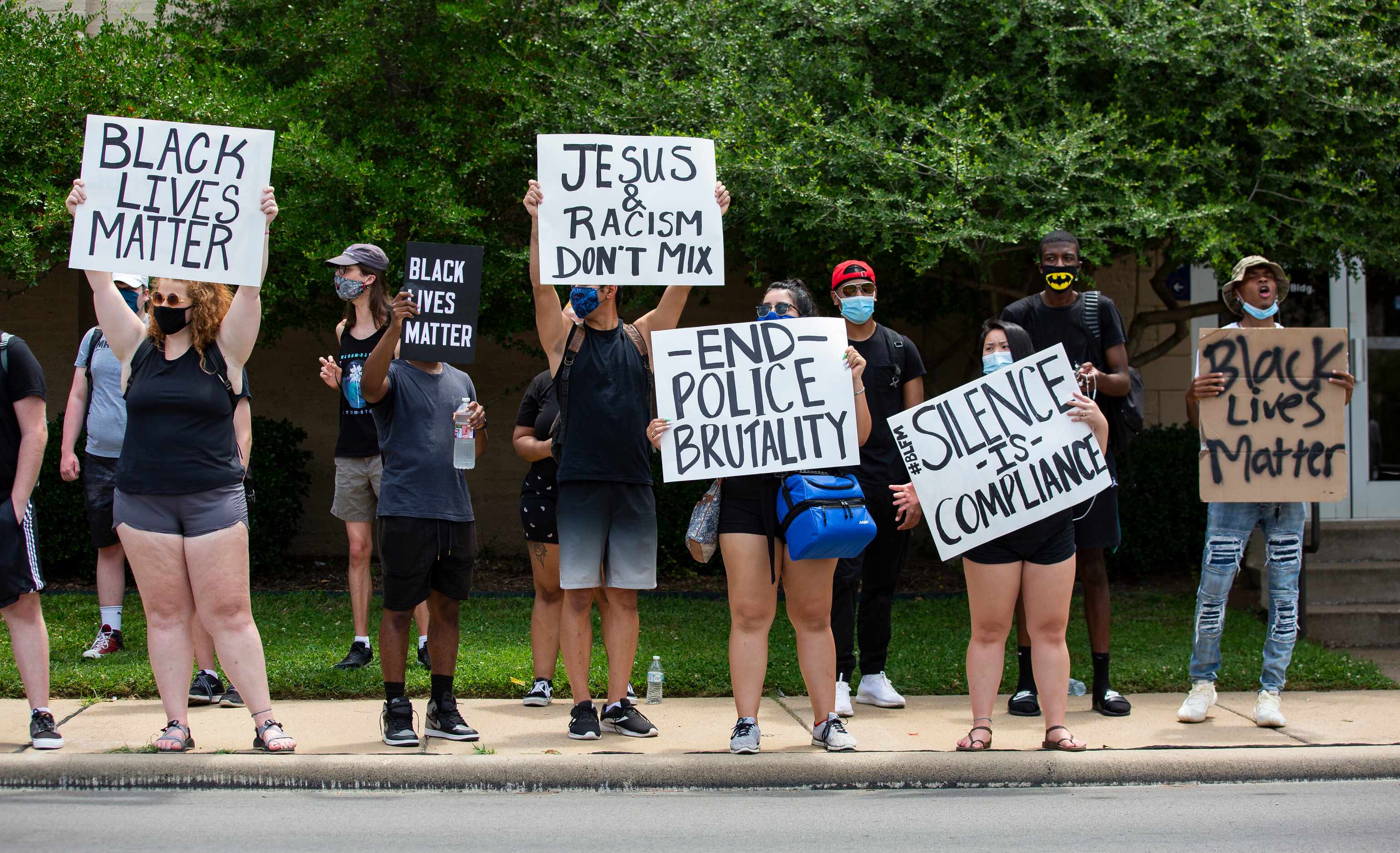 Protestors against police brutality line S Cooper St as they participate in the UTA School...
