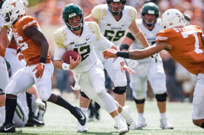 Baylor Bears quarterback Charlie Brewer (12) runs the ball during the first quarter of a...