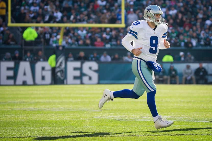 Dallas Cowboys quarterback Tony Romo (9) checks into the game during the first half of an...