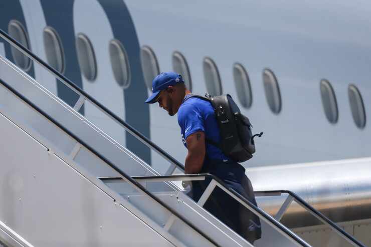 Dallas Cowboys quarterback Dak Prescott arrives to board the team charter to depart for...