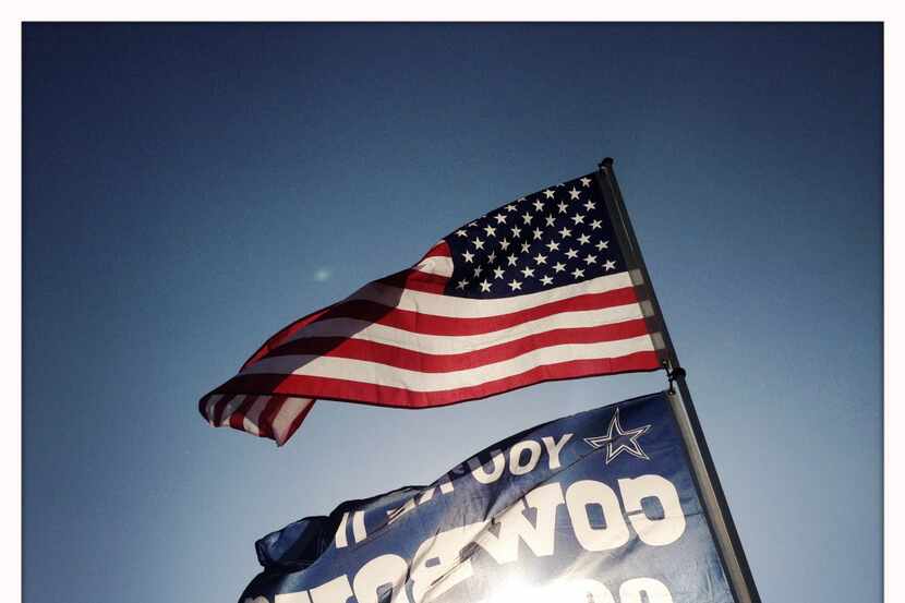 Dallas Cowboys fans fly their faithful flags. (Tom Fox/The Dallas Morning News)