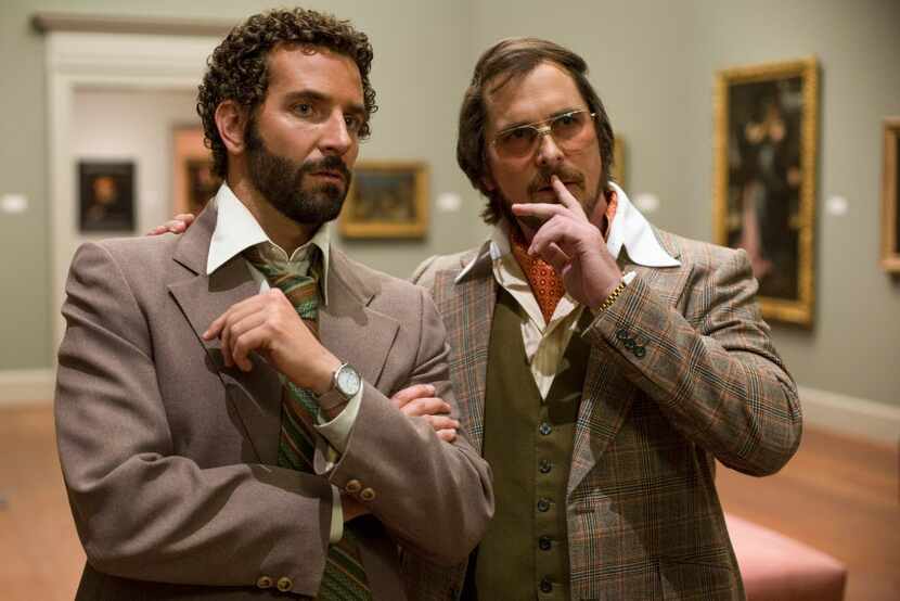 This film image released by Sony Pictures shows Bradley Cooper, left, and Christian Bale in...