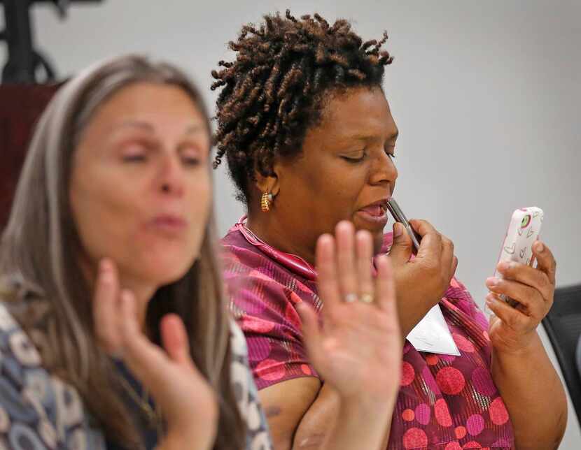 
Nedra Cameron tries some lipstick gifted to those attending the Women's Independence...