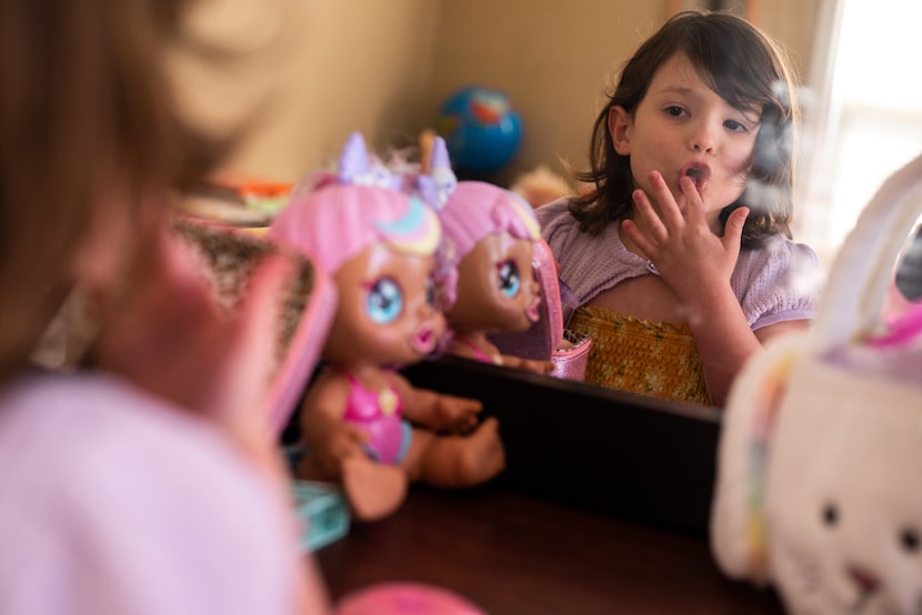 Isa applies lip gloss to her lips while playing with some of her favorite things inside her...