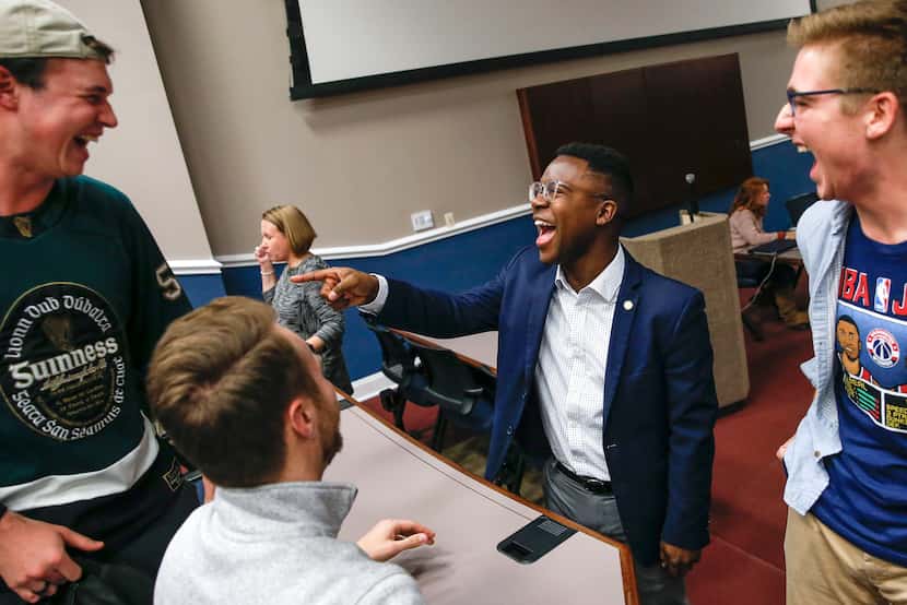SMU student body president, Darian Taylor, center, chats with Reed Wilkerson, left, Chris...