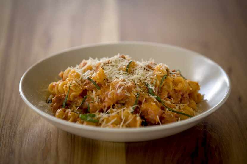 Fusilli with sausage, ramps and escarole in a brandy-touched creamy sauce