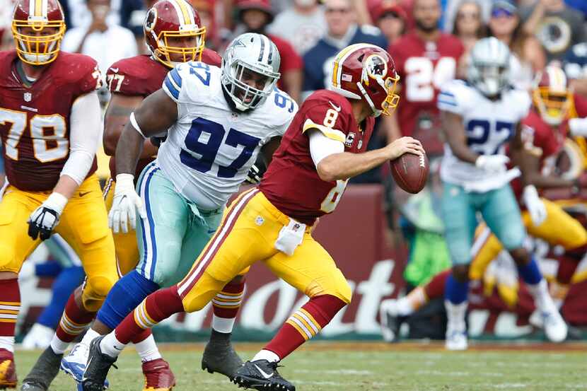Dallas Cowboys defensive tackle Terrell McClain (97) pressures Washington Redskins...